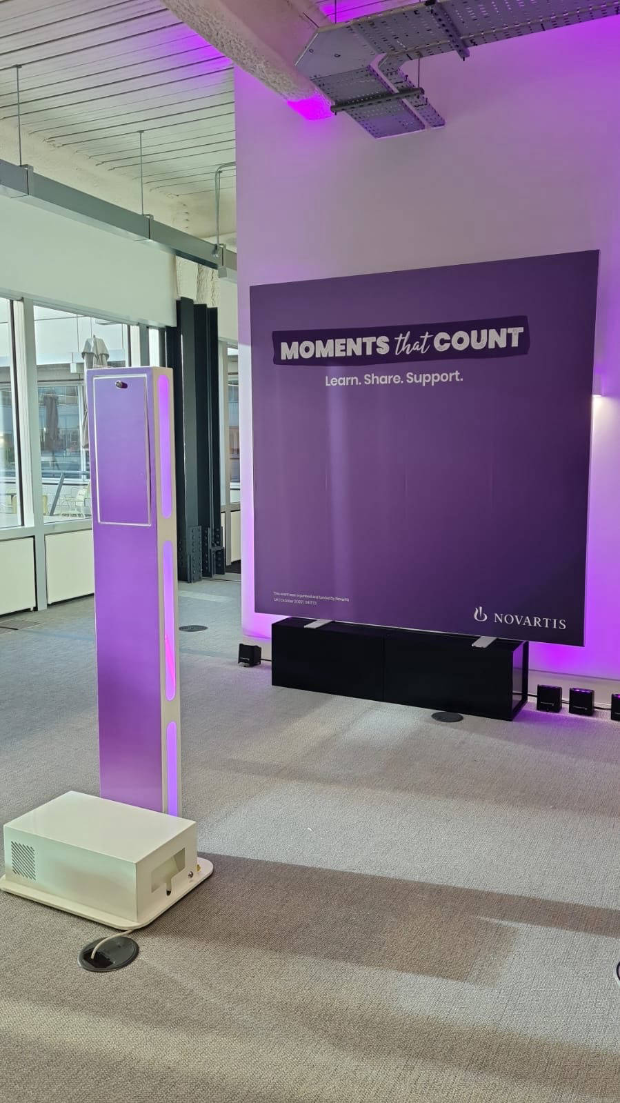 Purple branded Selfie Pod with backdrop.