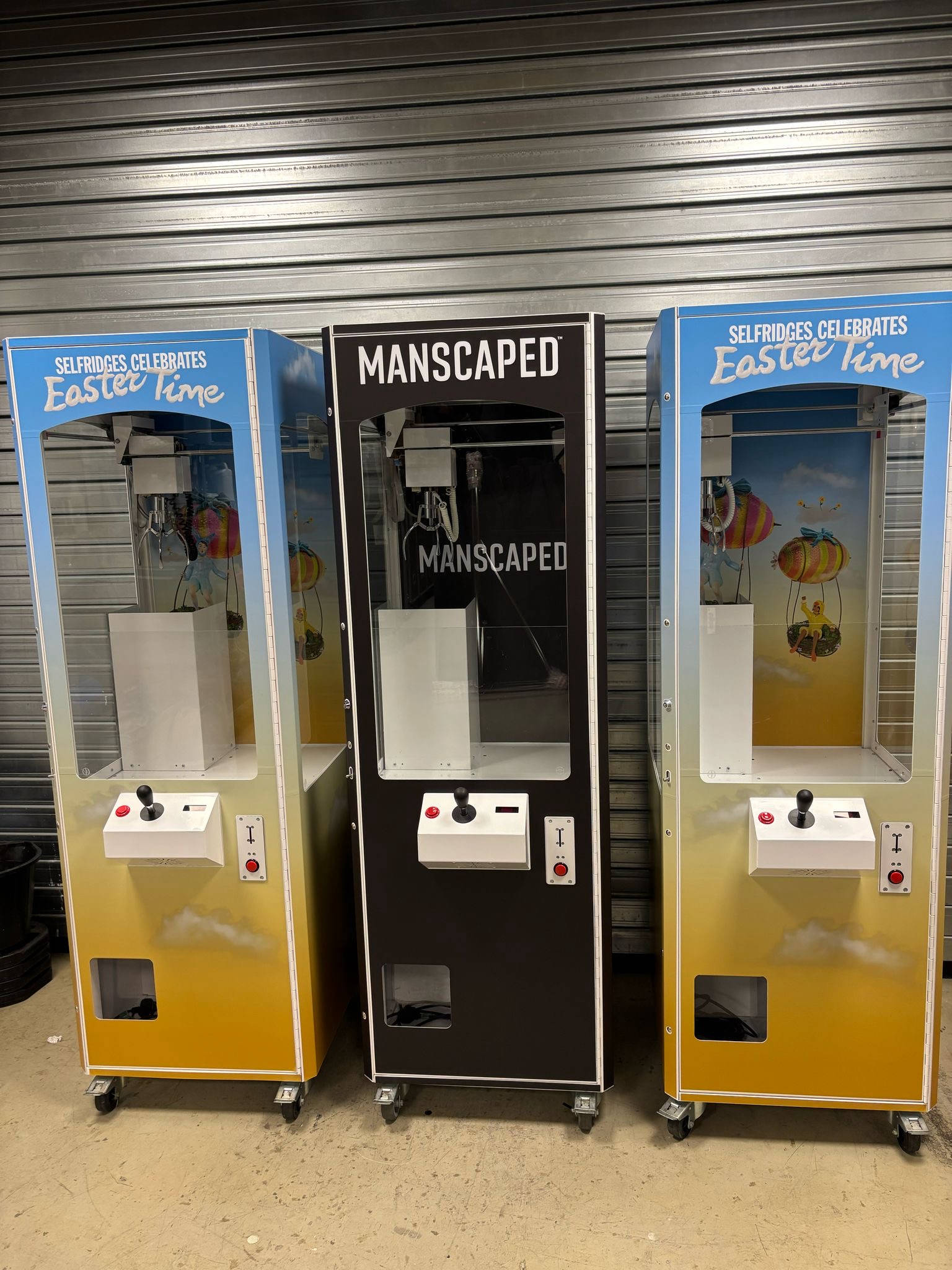 Example of fully branded prize claw machines.